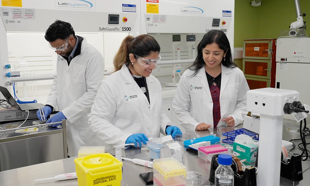 Professor Madhu Bhaskaran (right) with researchers in the Discovery 2 Device facility, an advanced medical technology prototyping and scale-up hub at RMIT's city campus.