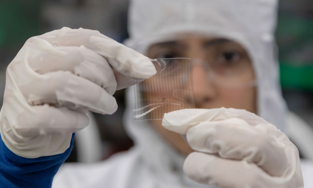 Distinguished Professor Madhu Bhaskaran holding one of the flexible sensors invented at RMIT.