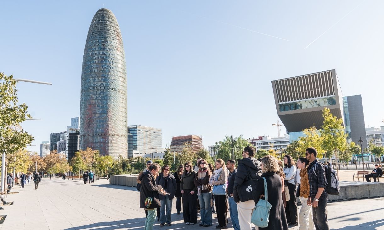 Students gathered at Plaça de les Glòries, Barcelona in a group, being spoken to by Jordi Marfà.