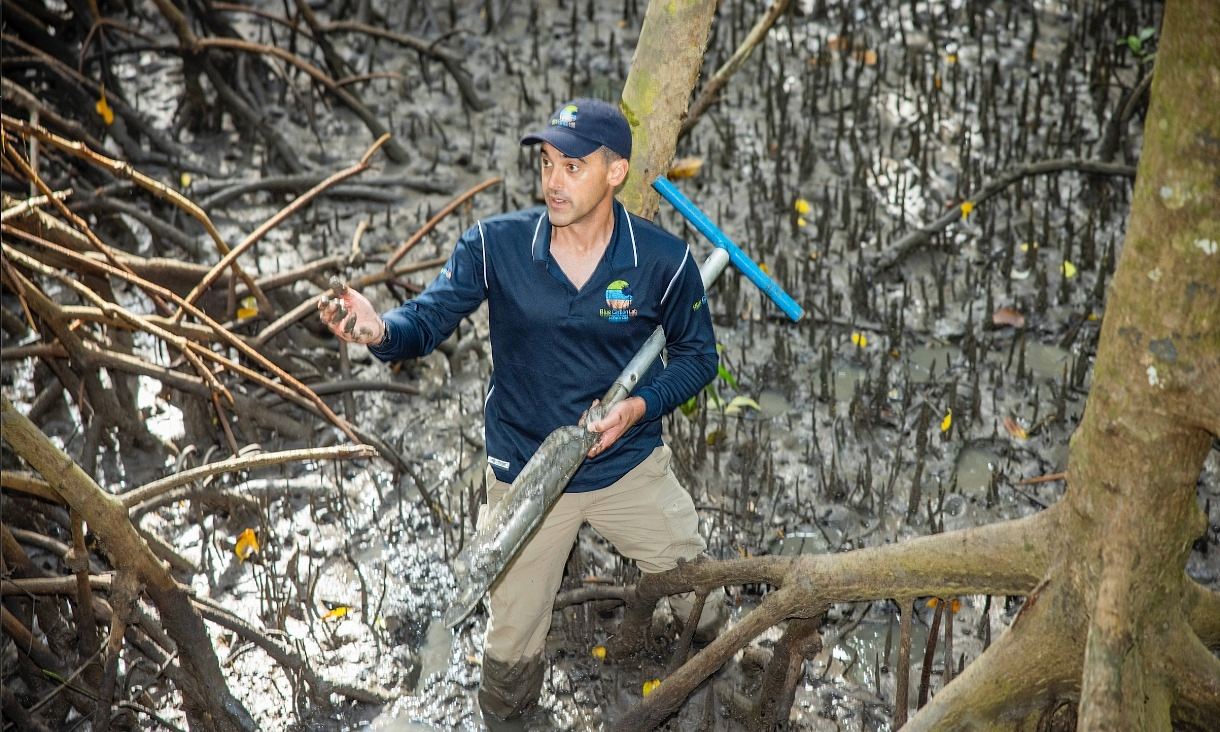 Professor Peter Macreadie measuring carbon sequestration in mangrove forests around Cairns. Credit: Through The Looking Glass Studio.