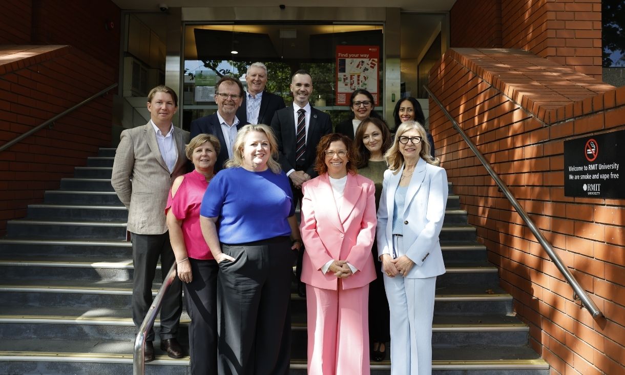 University staff, including Mish Eastman and Professor Catherine Itsiopoulos, with the minister.