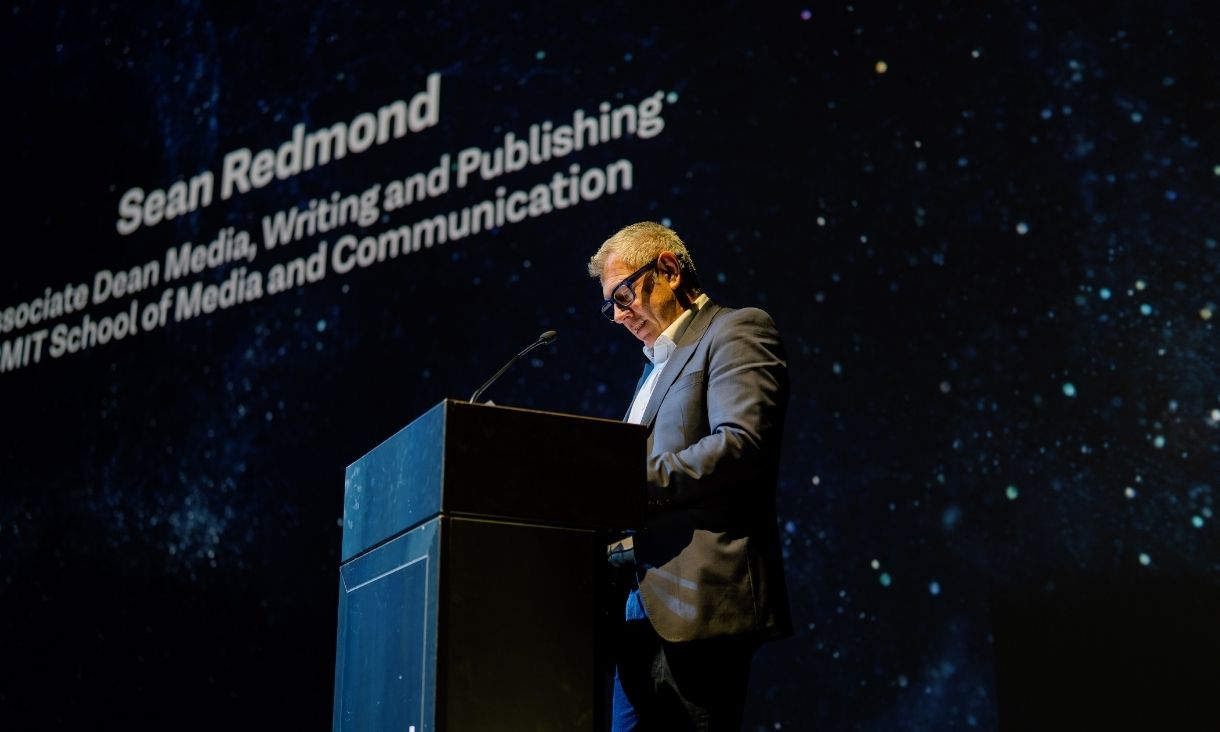 Professor Sean Redmond speaking on a stage at the awards ceremony