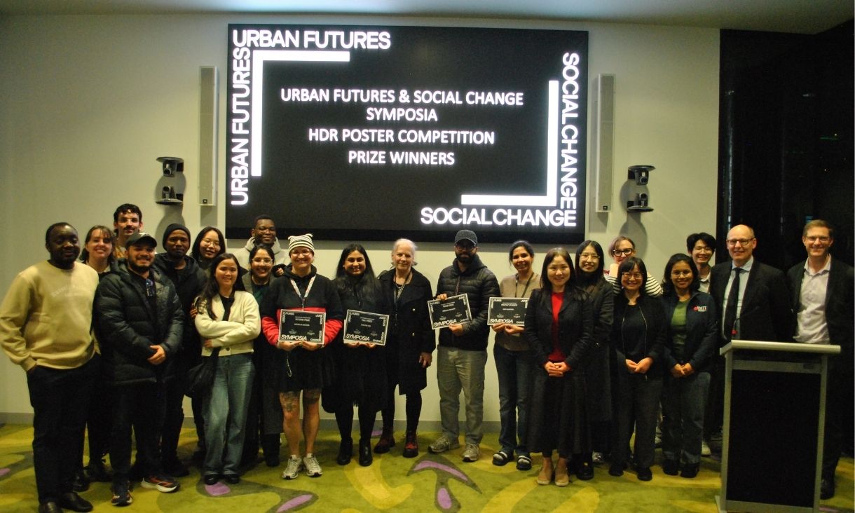 Winners stand lined up with their certificates.