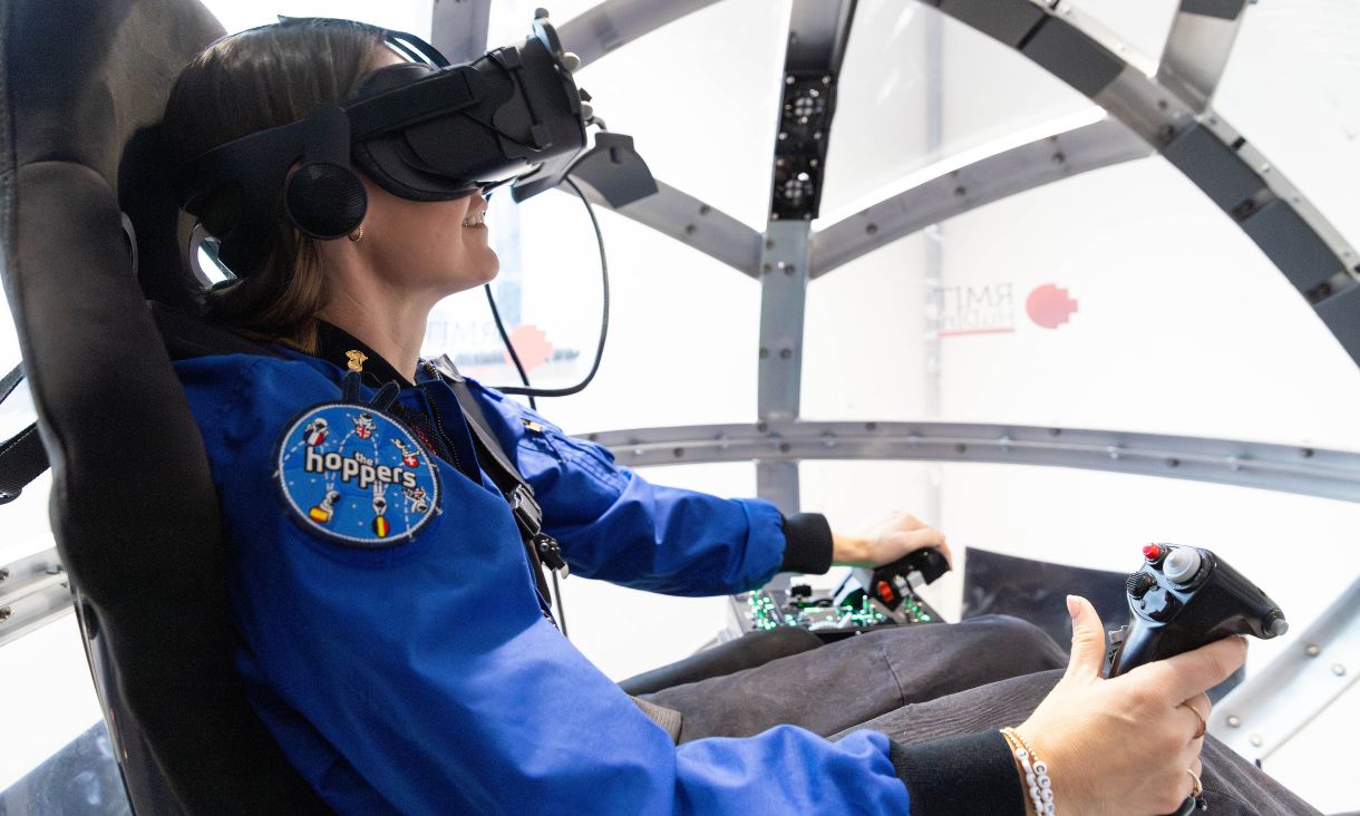 Katherine Bennell-Pegg using RMIT's Nova360 helicopter simulator.