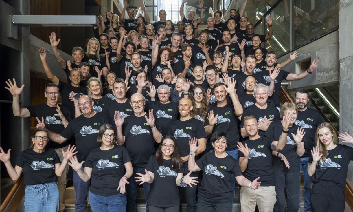 A large group of people pose for a photo.