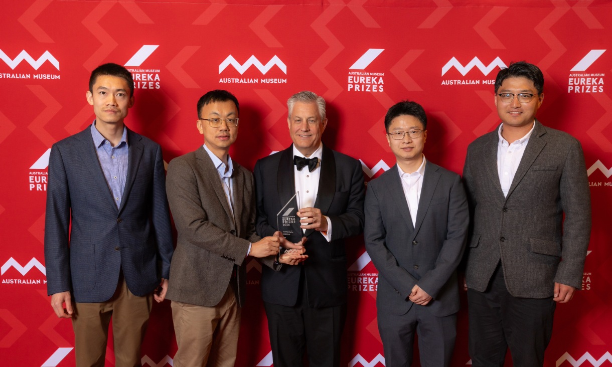 Eureka Prize winners holding trophy