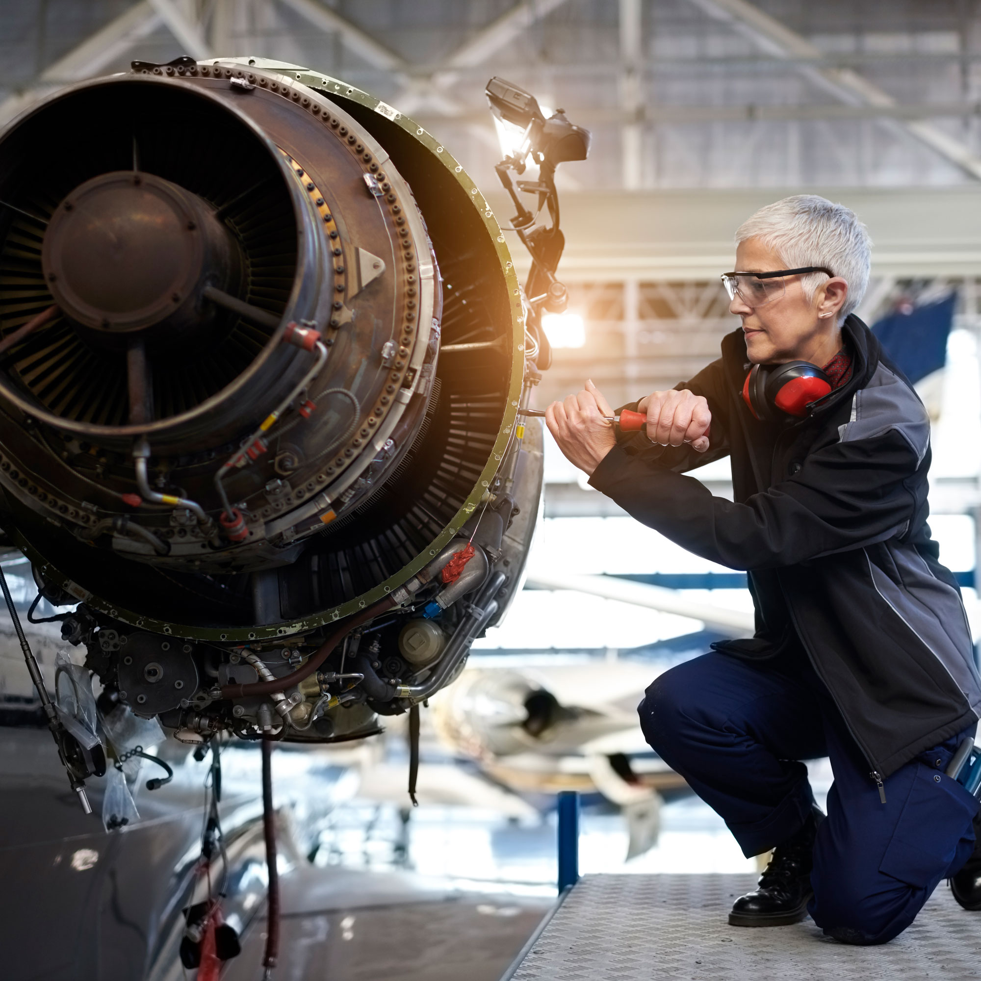 Image of a person working on a mechanical device