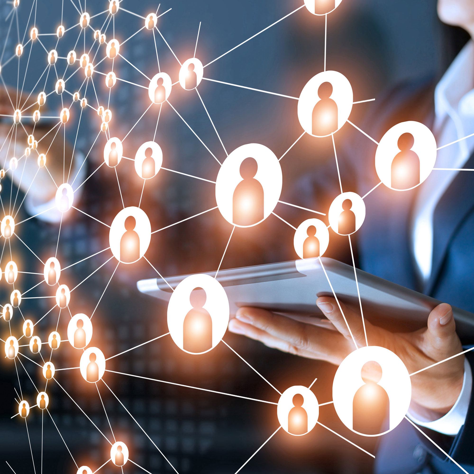 Digital screen with person on a laptop behind