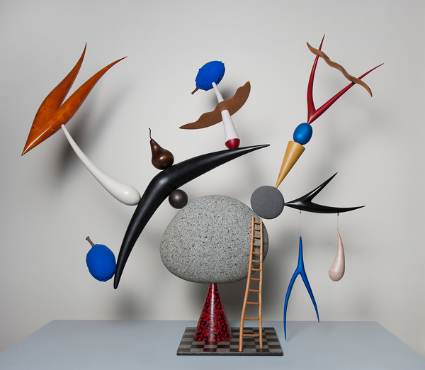 An abstract sculpture of precariously balanced objects