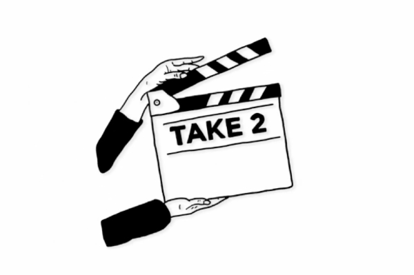A black and white illustration of a pair of hands holding an open clap board that says 'Take 2'