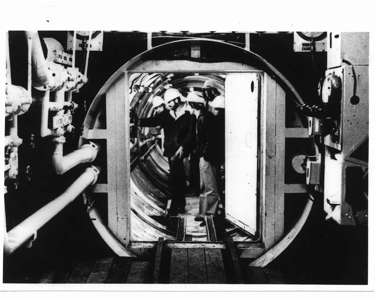 Civil Engineering Students Inspecting Rail Loop Air Lock, 1977 (Image credit: RMIT University Archives)