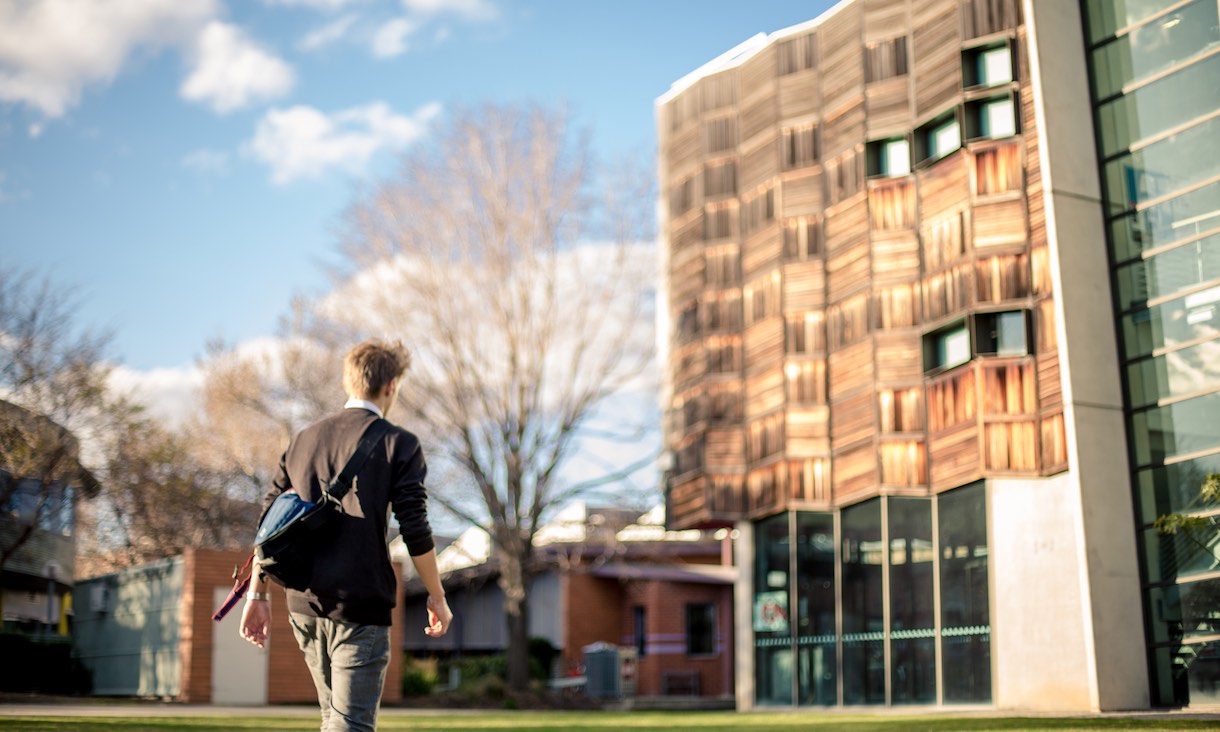 student walking through RMIT brunswick campus