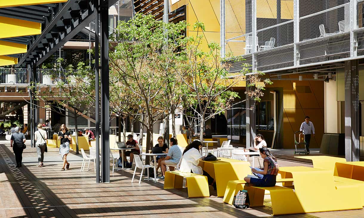 Yellow seats and tables outside RMIT's NAS building