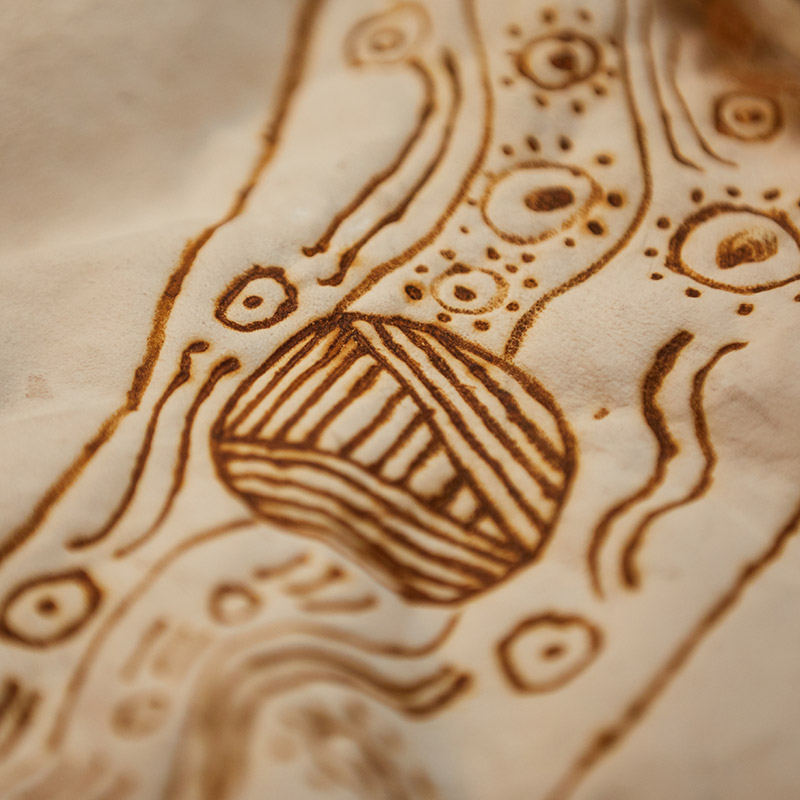 photograph of Indigenous artwork drawn on cream paper