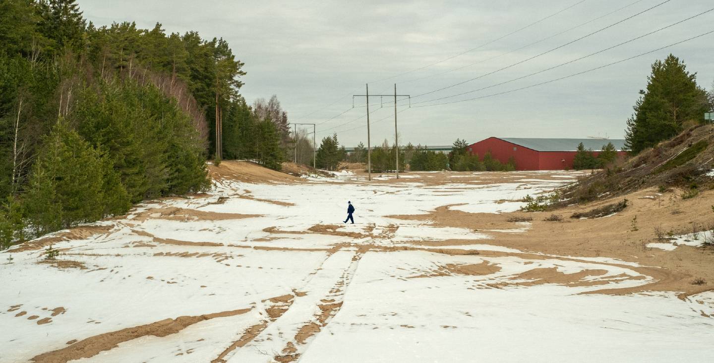 Image of a person walking in the snow.