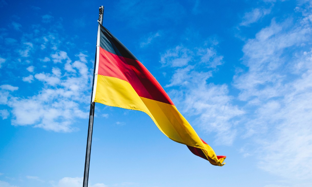 German flag waving against a backdrop of the sky