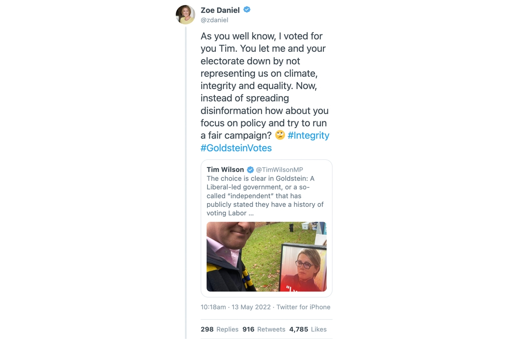 A screenshot of a tweet (from the account of Tim Wilson, and featuring a photo of him next to a sign for his opponent) that has been quoted by Zoe Daniel.