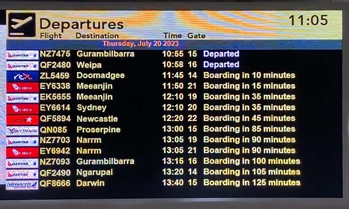 flight information board showing times and flight destinations