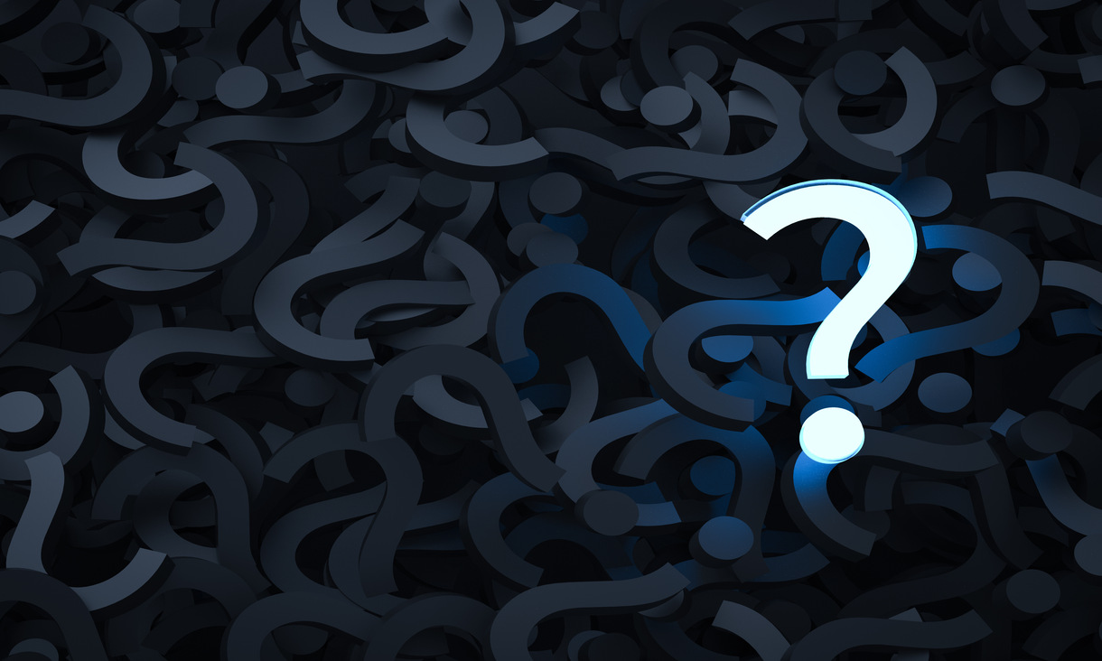 image of white question mark against a background of black question marks