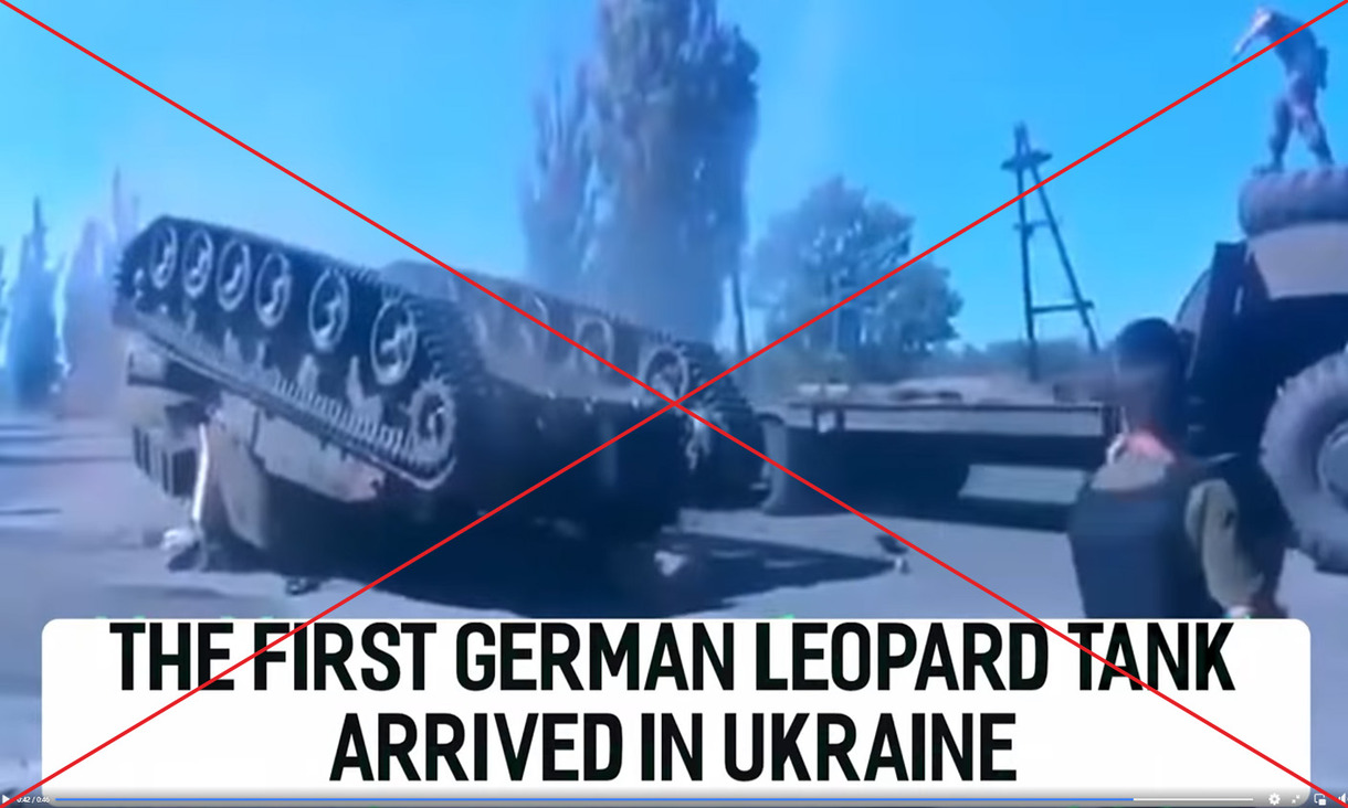 Red cross through a screenshot of military vehicle lying upside down on the ground with incorrect caption that reads: The first German Leopard  tank arrived in Ukraine