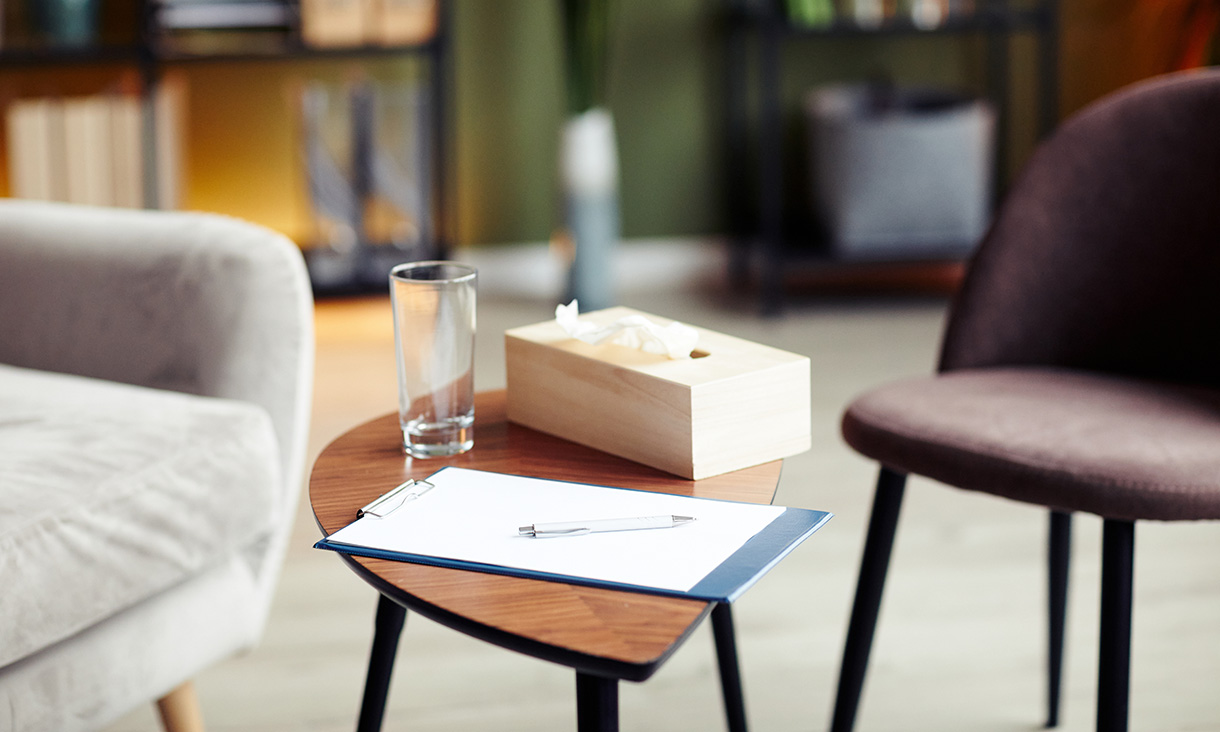 Two empty chairs in a therapist's room