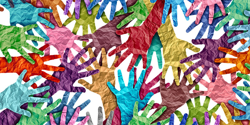 Overlapping colourful paper hands.