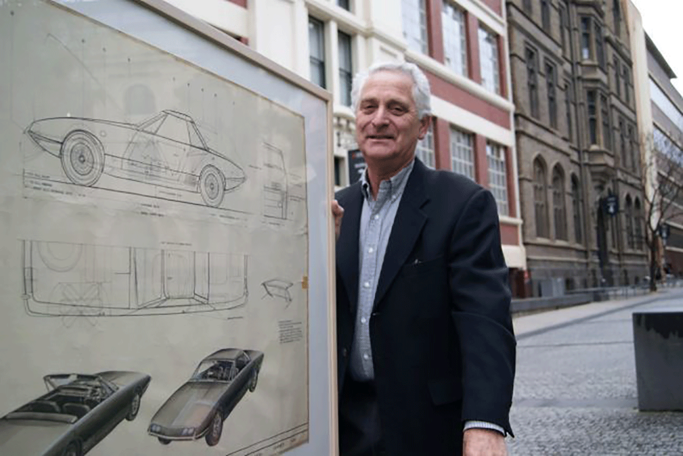 Phillip Zmood with one of his donated car sketches