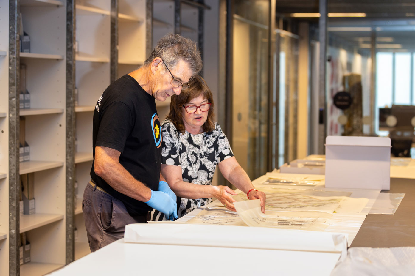 Design histories revealed: RDA Curatorial Officer, Ann Carew and Tony Isaacson with drawings from the Peter Elliott Collection, catalogued in 2025.