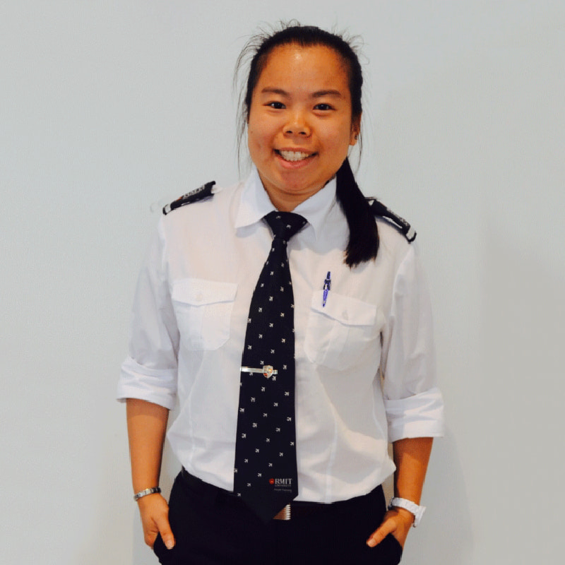 Young woman wearing a pilot's uniform.