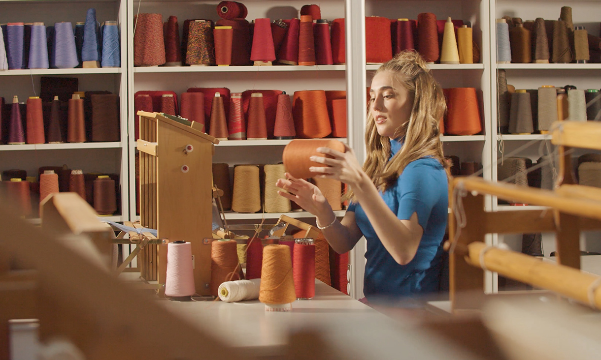 Student examining some thread