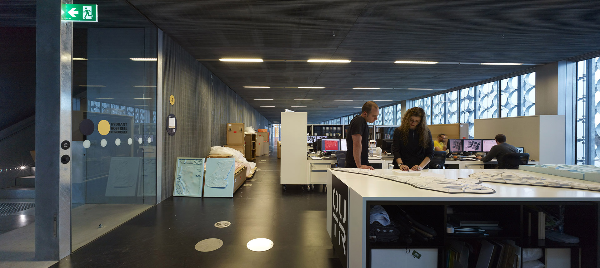 Students in workspace of design hub building