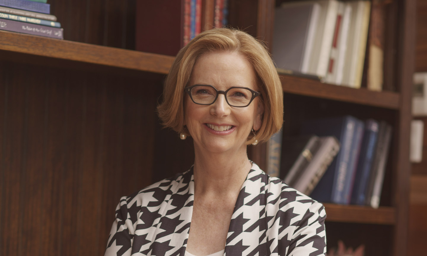 Julia Gillard in front of bookshelves