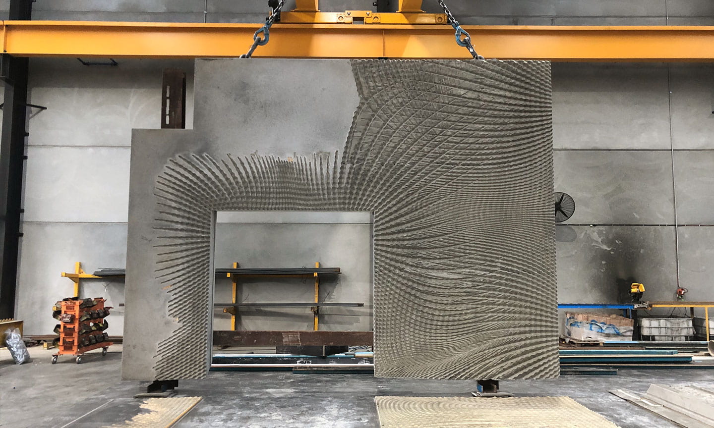 Pre-cast concrete walls featuring 3D pattern works stored in warehouse facility