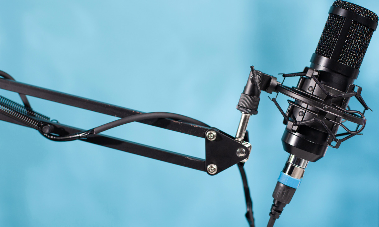 Podcast mic on blue background