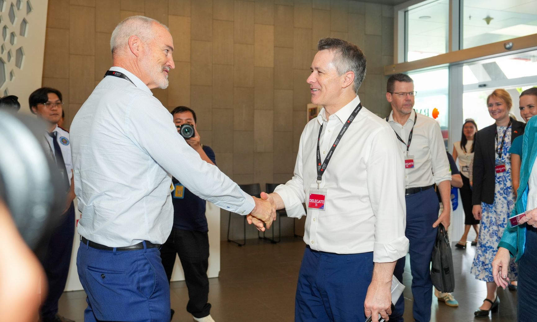 Minister Clare greets Professor Cameron during his visit to RMIT Vietnam.