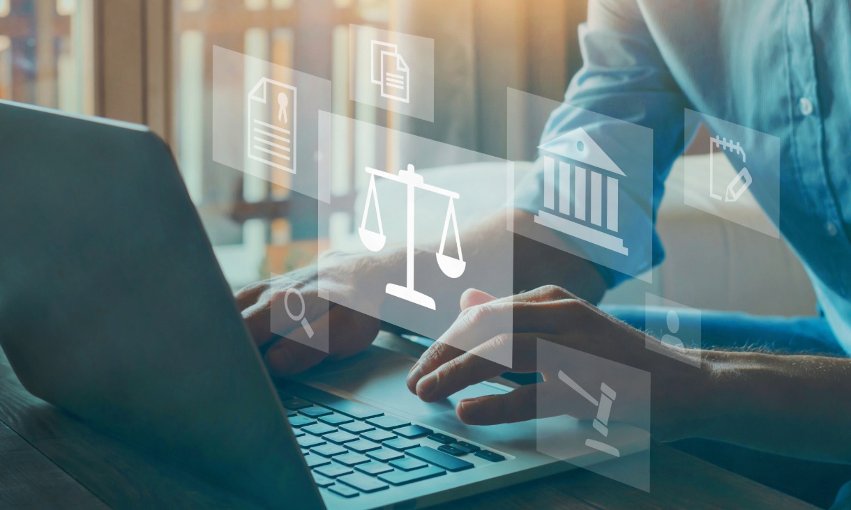 Close up of person using laptop with graphics over it