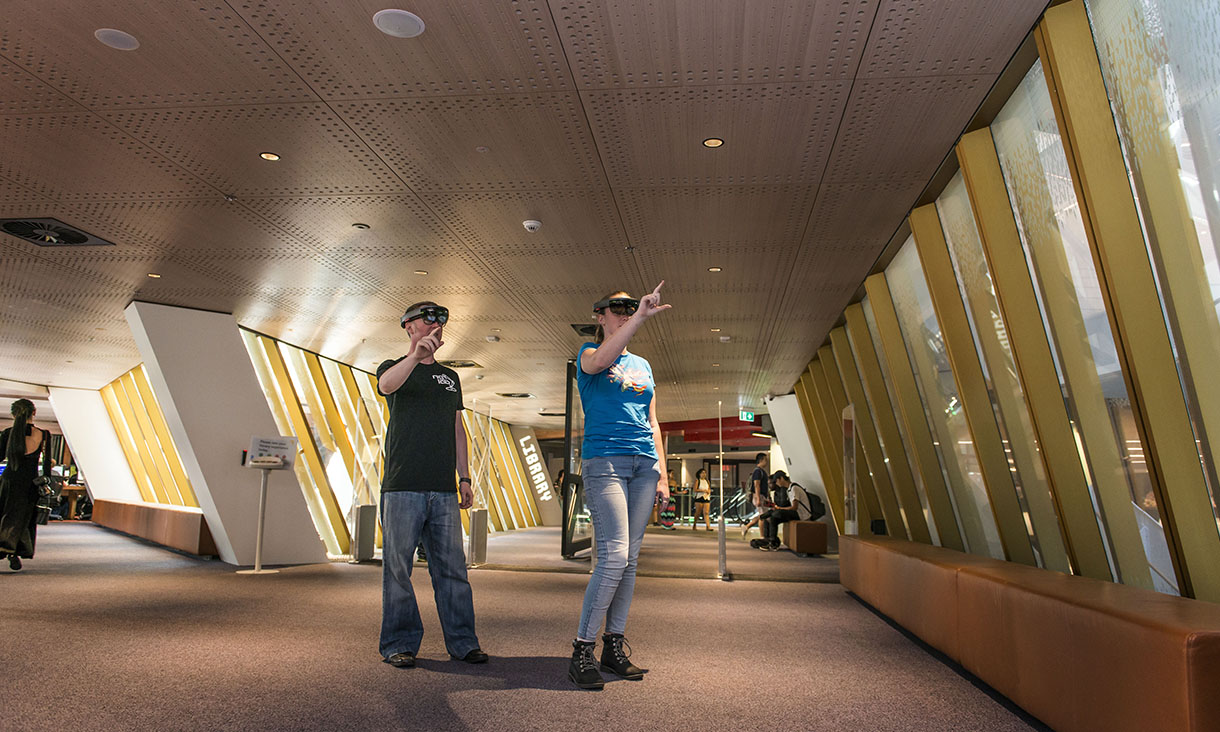 RMIT researchers experiencing mixed reality using Microsoft’s HoloLens device.