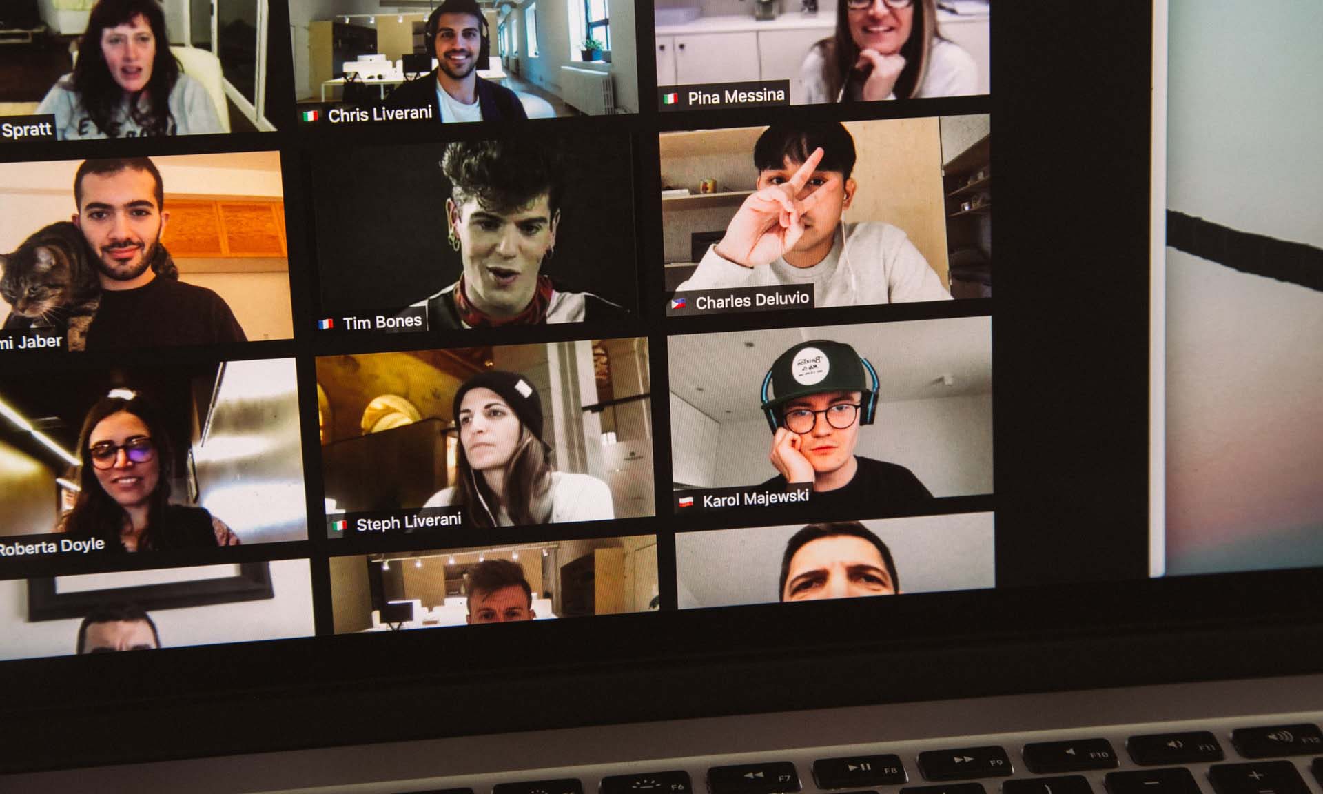 Group of people video conferencing on laptop