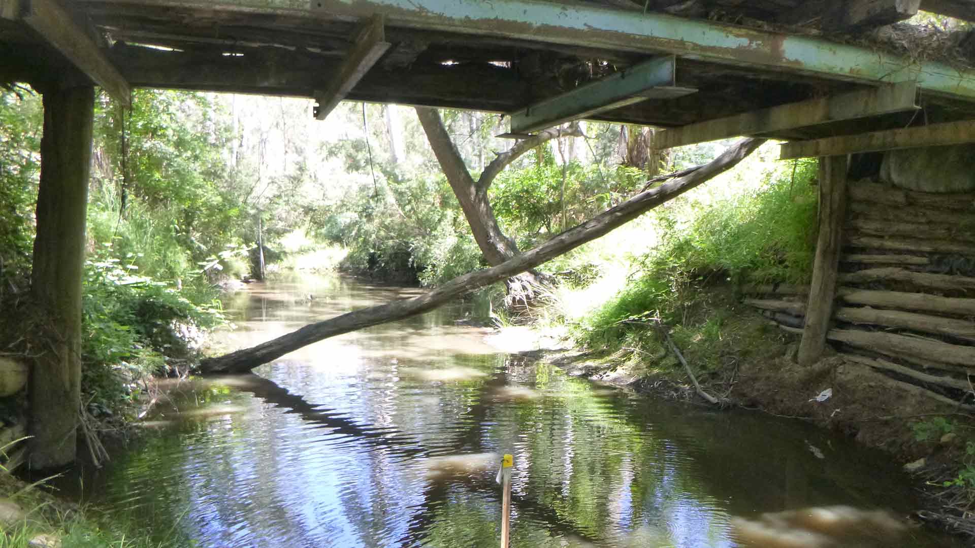 A waterway under a bridge