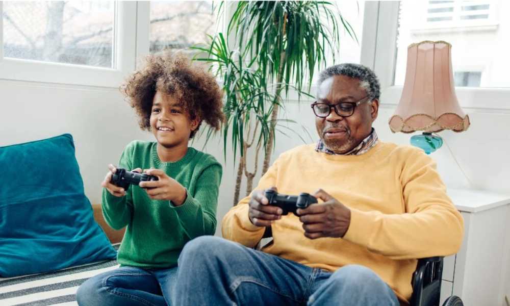 Child and elderly person playing video games