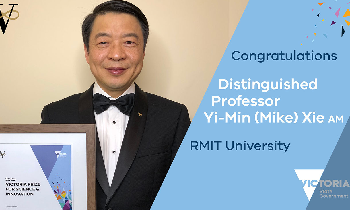 Yi Min Mike Xie posing in front of a wall and holding a framed certificate of the award. Mike is wearing a suit and smiling towards the camera. On one side of the photo there is text against a solid blue background that says 'Congratulations Distinguished Professor Yi-Min (Mike), RMIT University' with a logo of Victoria State Government underneath.
