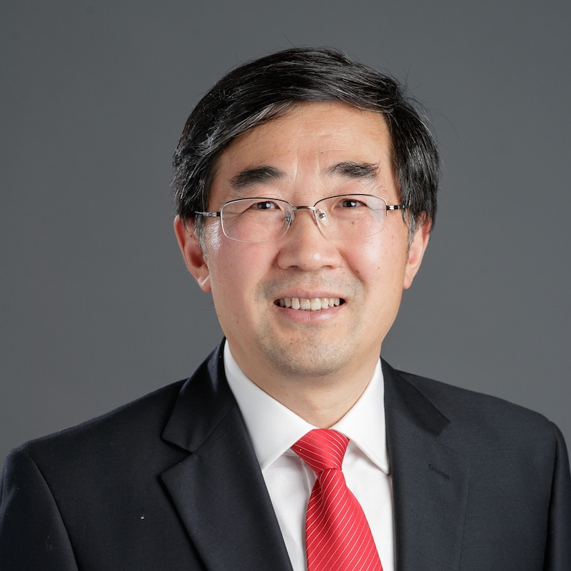 Songlin Ding profile photo he is smiling while wearing a suit and glasses