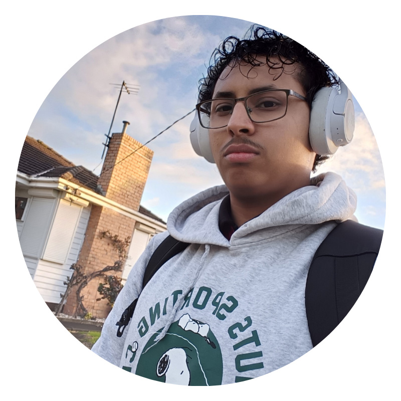 Male student with headphones and hoodie.