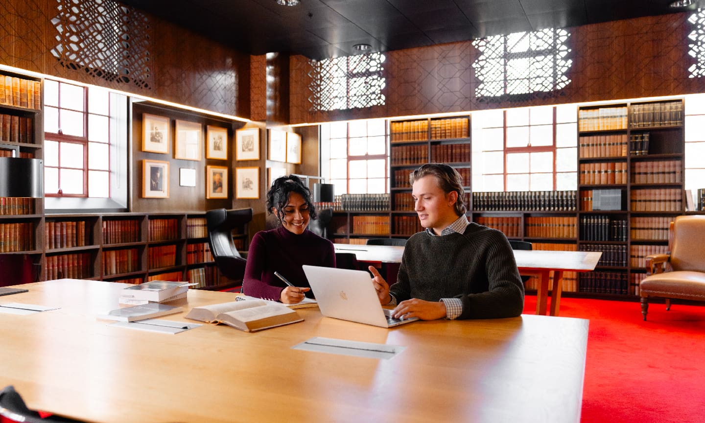 Two law students working in a library on-campus
