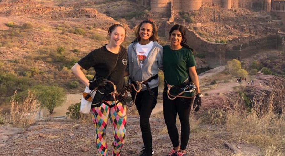 Photo of Libby and two other students in desert-like environment