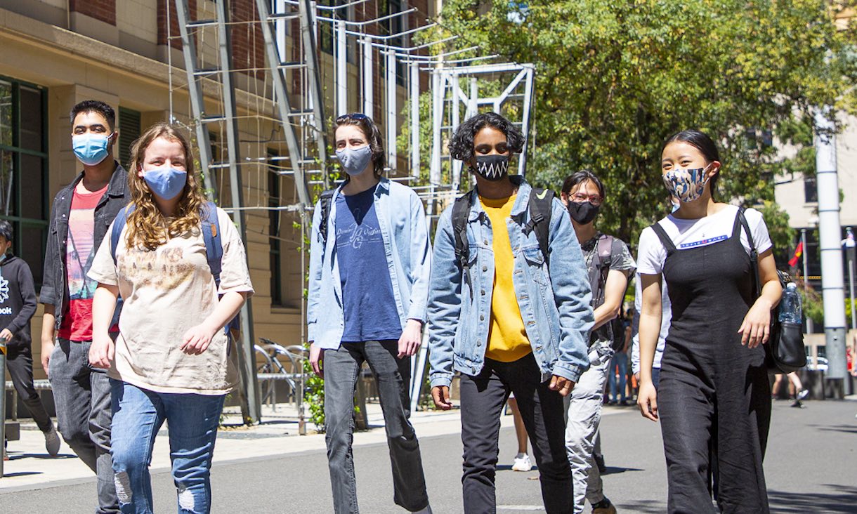 Students wearing masks on Bowen St.