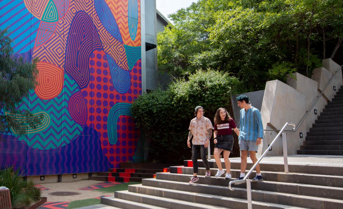 Students walking downstairs outside