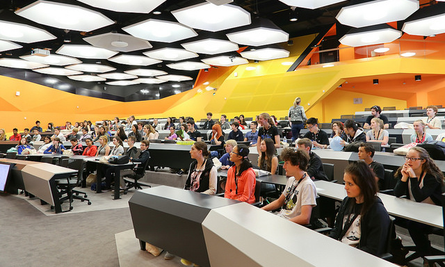 Students sit in a lecture hall at the City Campus.