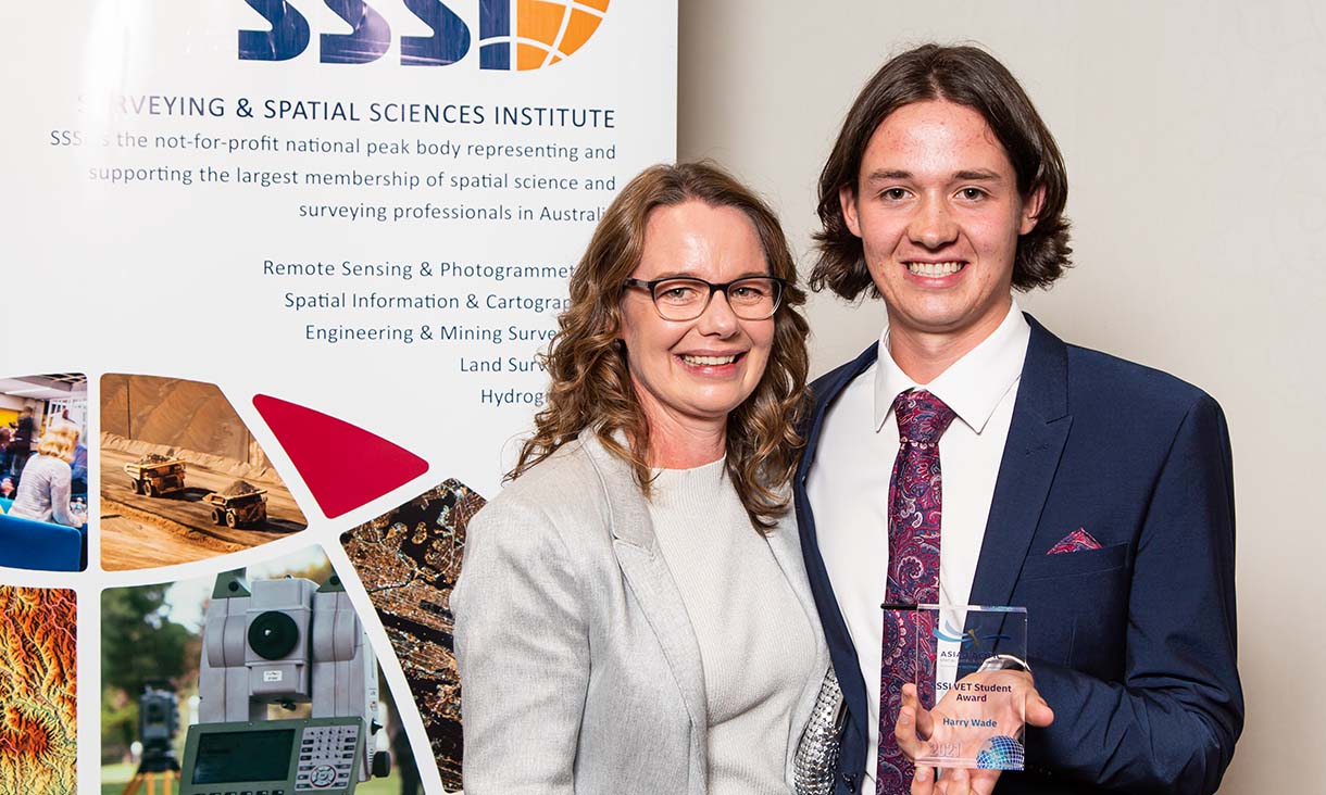 Student Harry Wade holding his APSEA award