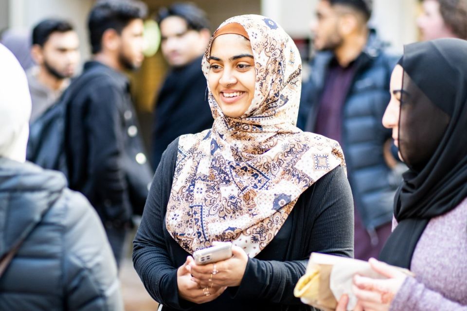 student at Eid al Adha celebrations smiling